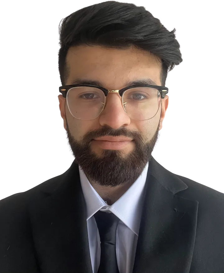 Portrait of Mohammad Haseeb Iqbal in a dark suit and glasses
